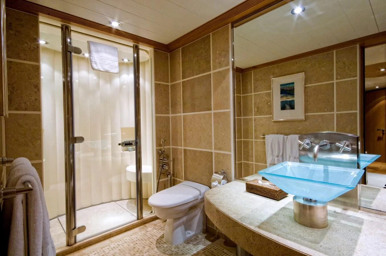 a bathroom with a glass sink aboard KIJO Yacht for Sale