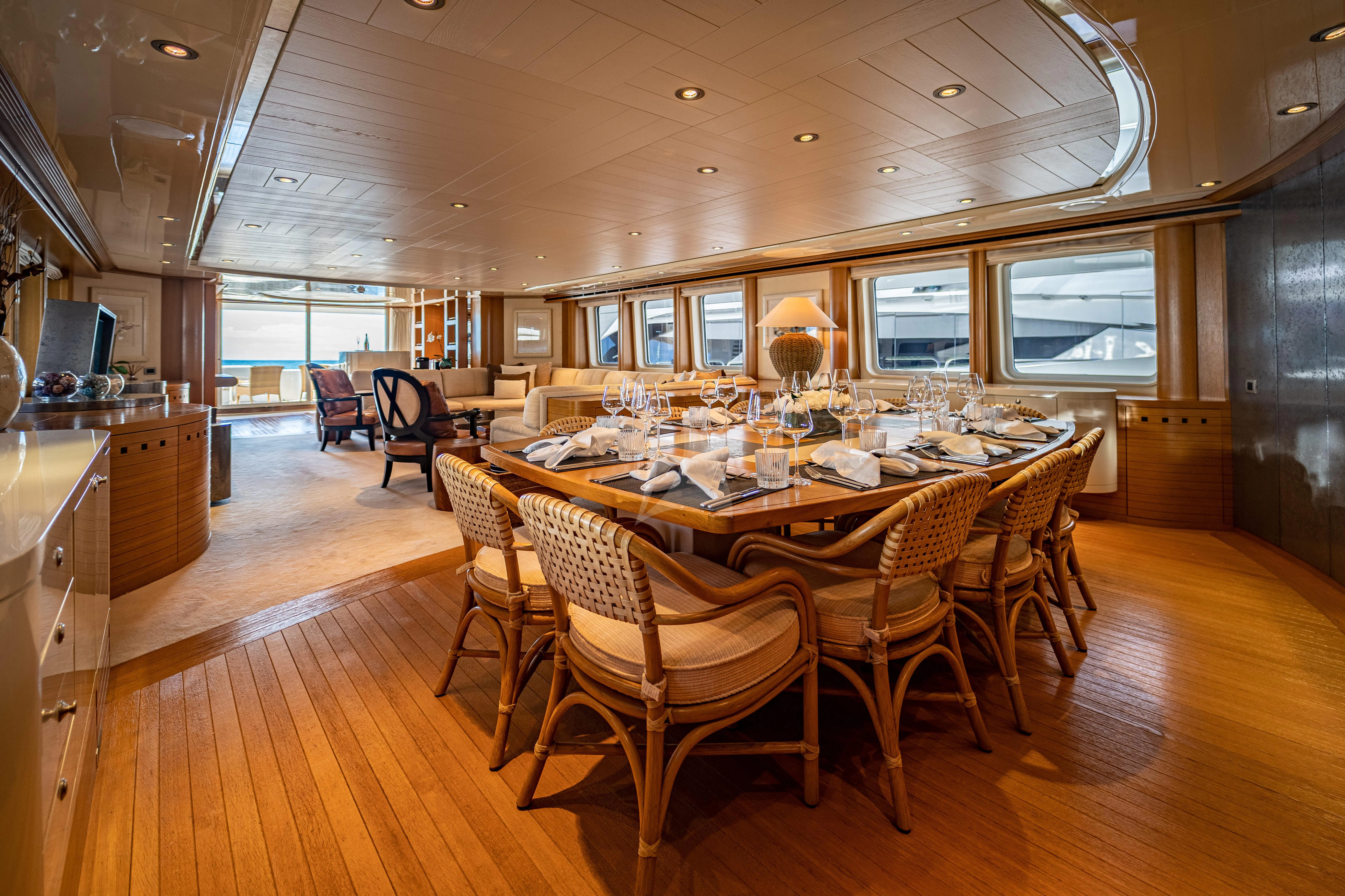 a large kitchen with a dining table aboard KIJO Yacht for Sale