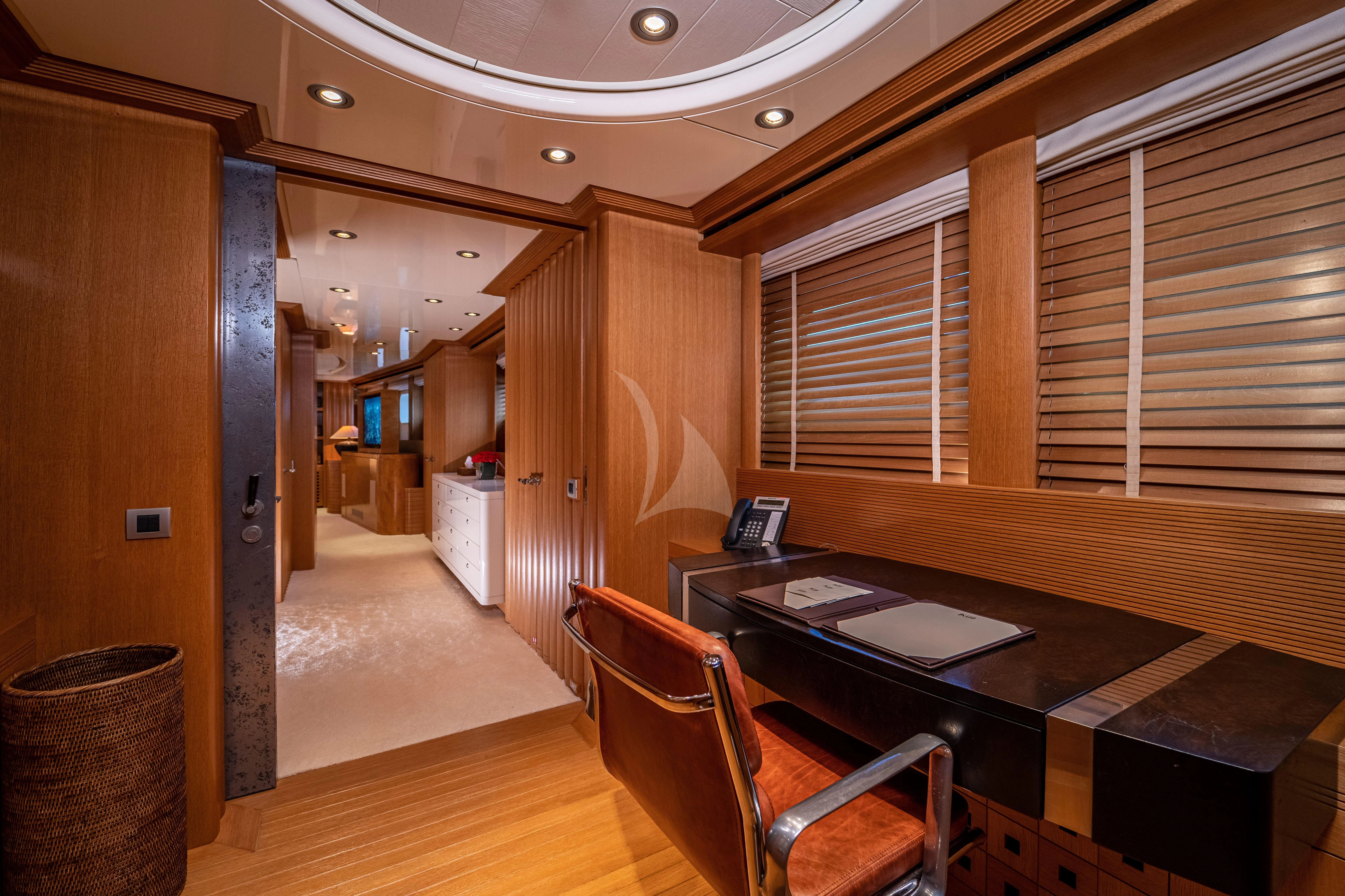 a room with a table and chairs aboard KIJO Yacht for Sale
