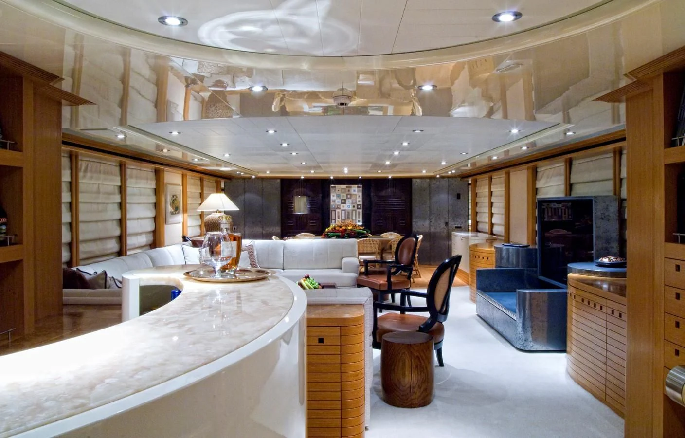a large room with a large table and chairs aboard KIJO Yacht for Sale