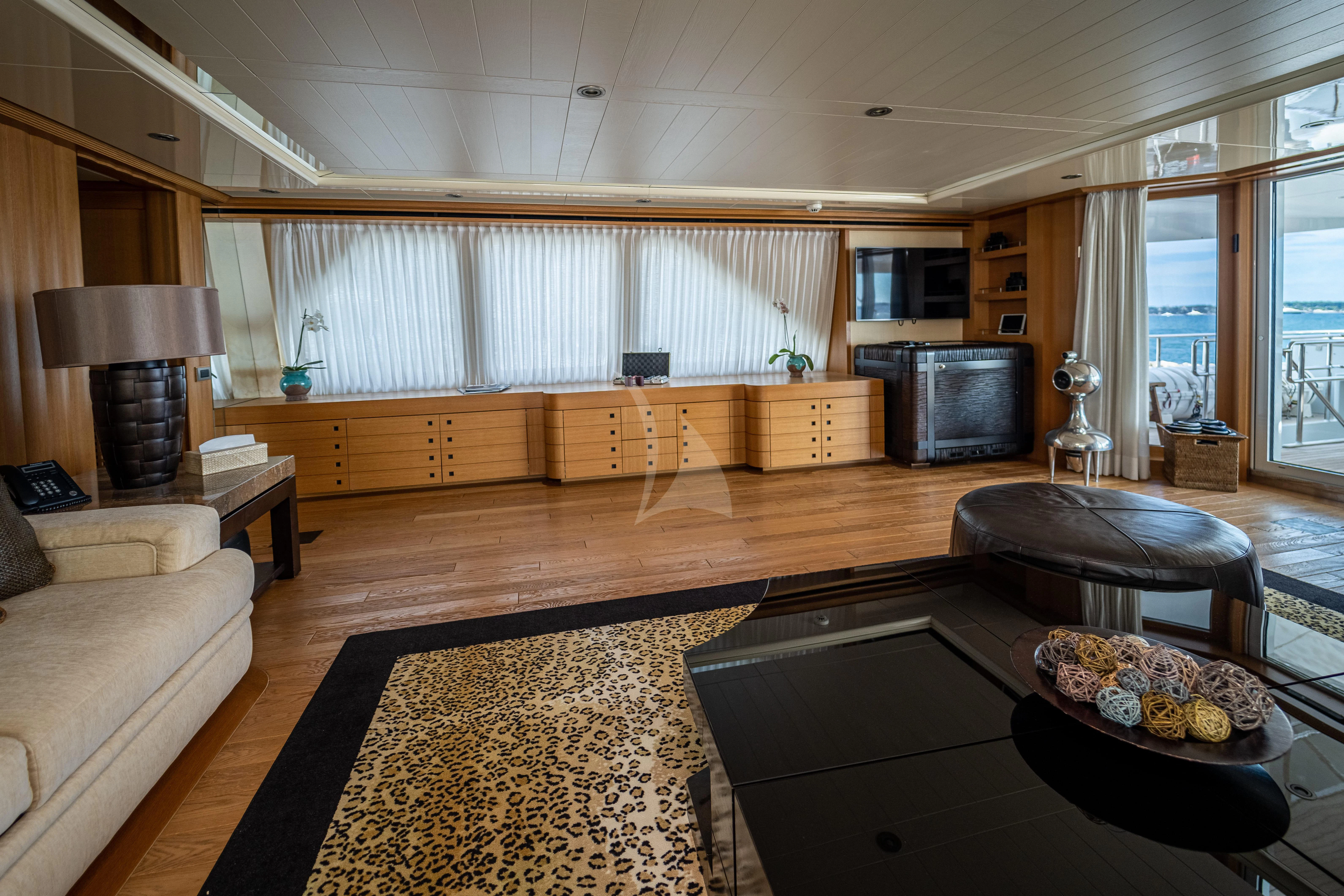 a living room with a fireplace aboard KIJO Yacht for Sale