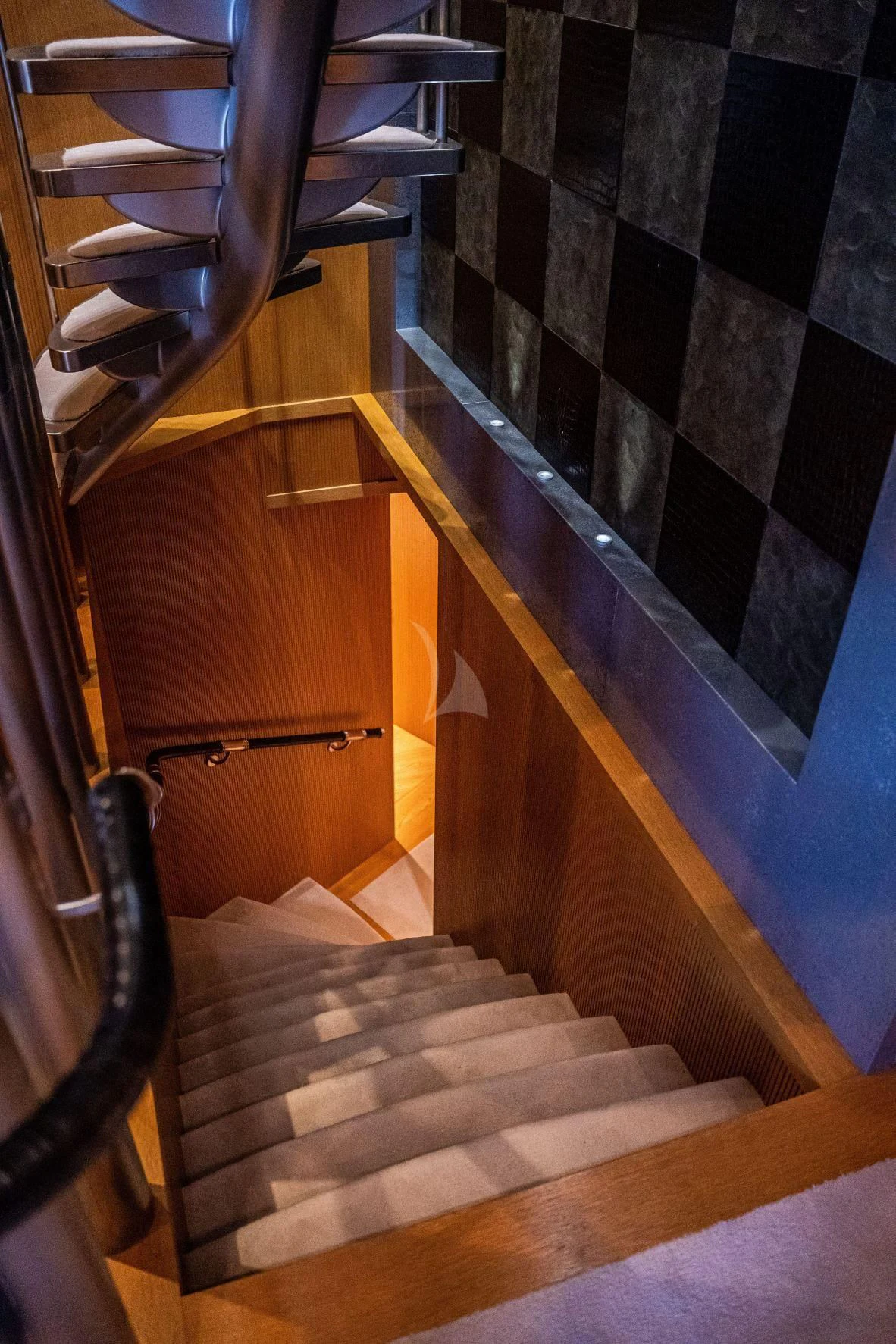 a staircase with a black and white tile floor aboard KIJO Yacht for Sale