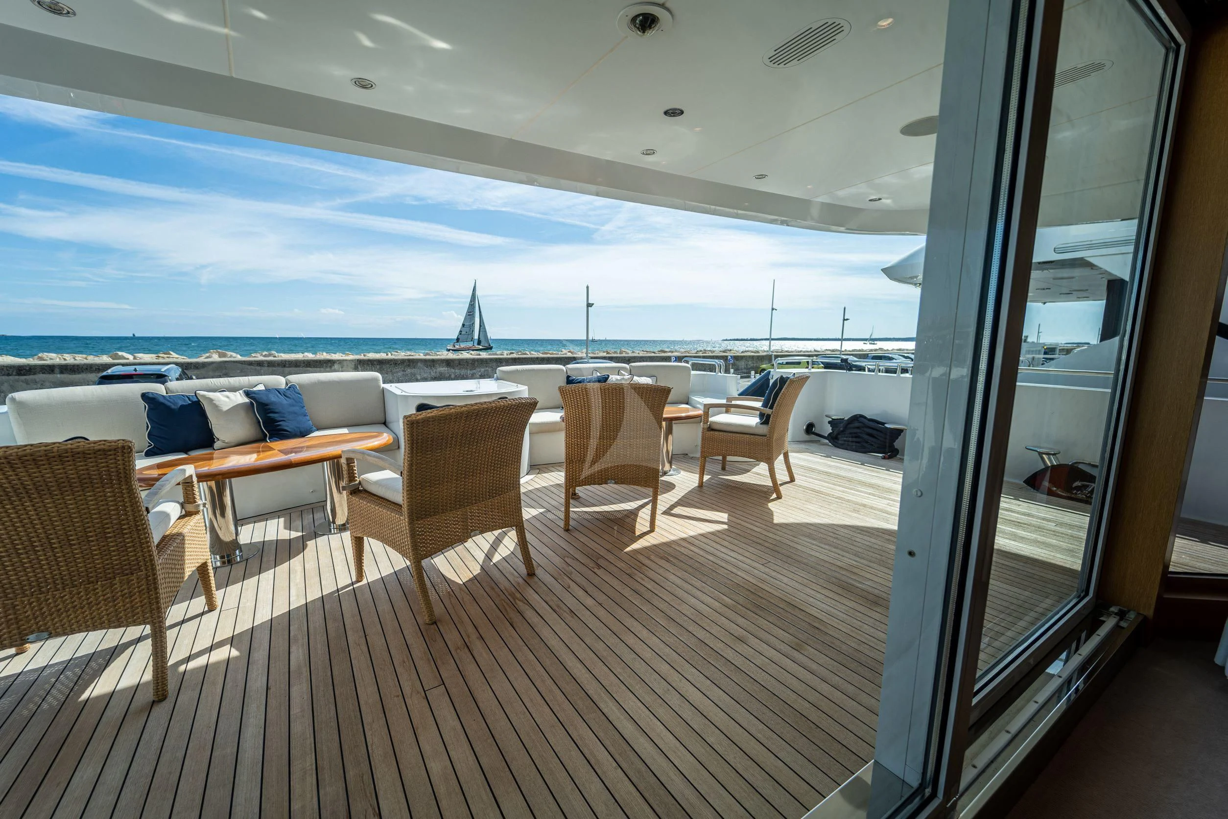 a room with a view of the ocean and a deck aboard KIJO Yacht for Sale
