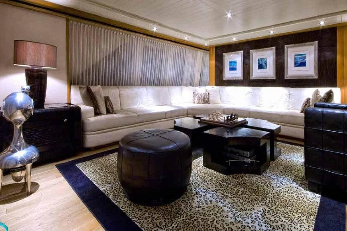 a living room with a couch and a coffee table aboard KIJO Yacht for Sale