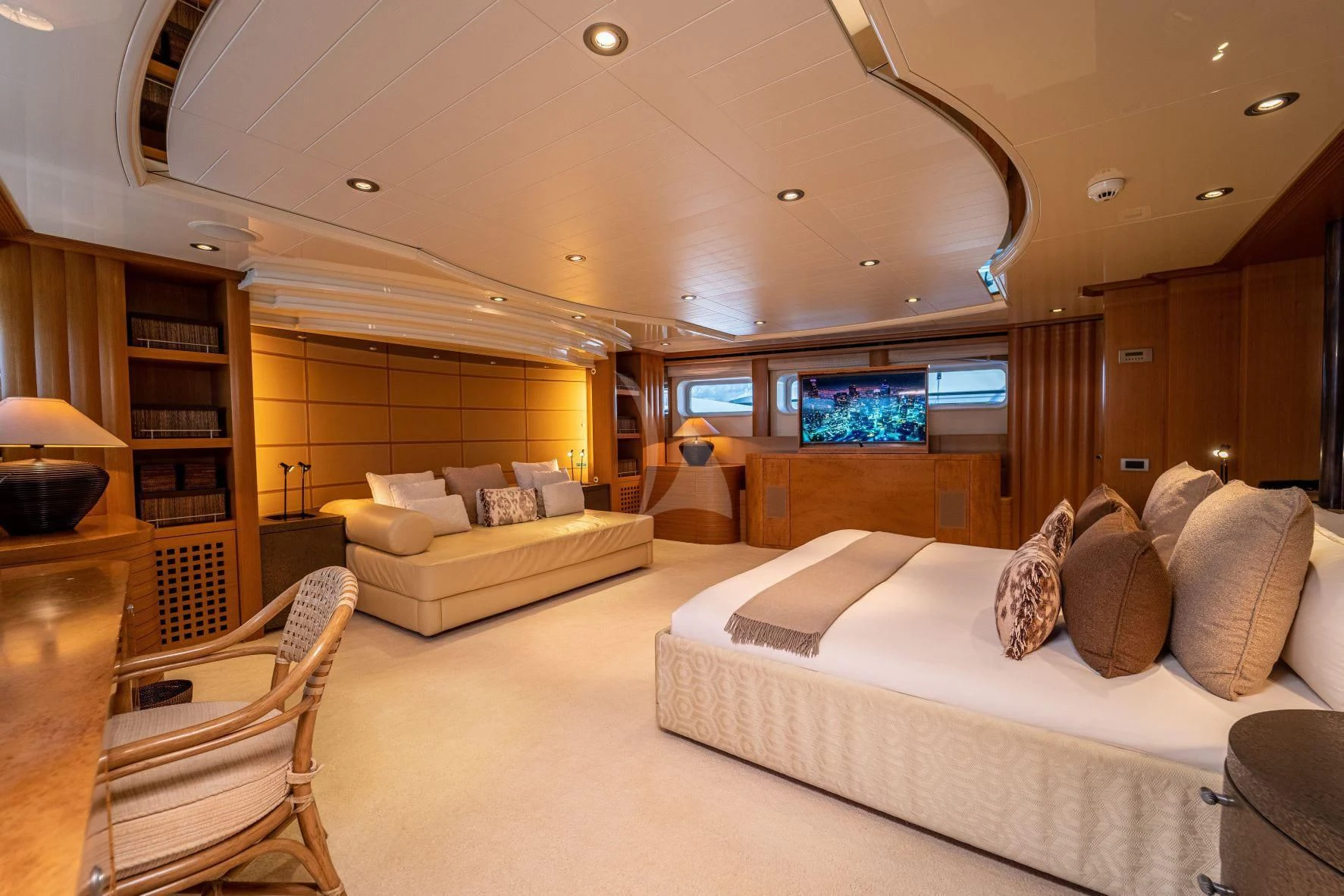 a large bedroom with a bed and a large window aboard KIJO Yacht for Sale