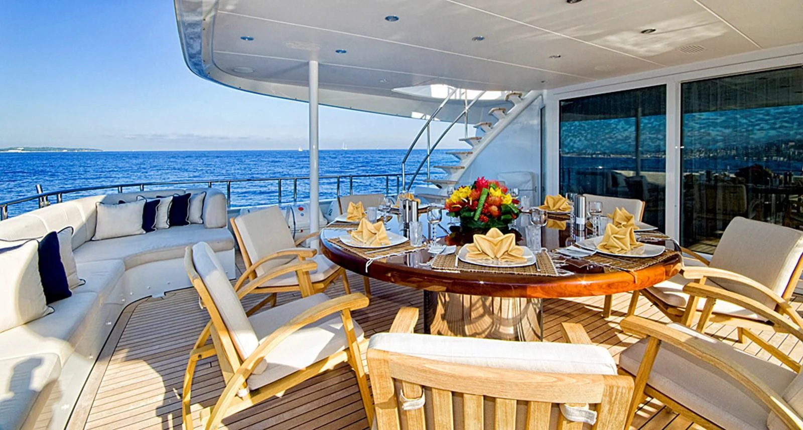 a table with chairs on it aboard KIJO Yacht for Sale