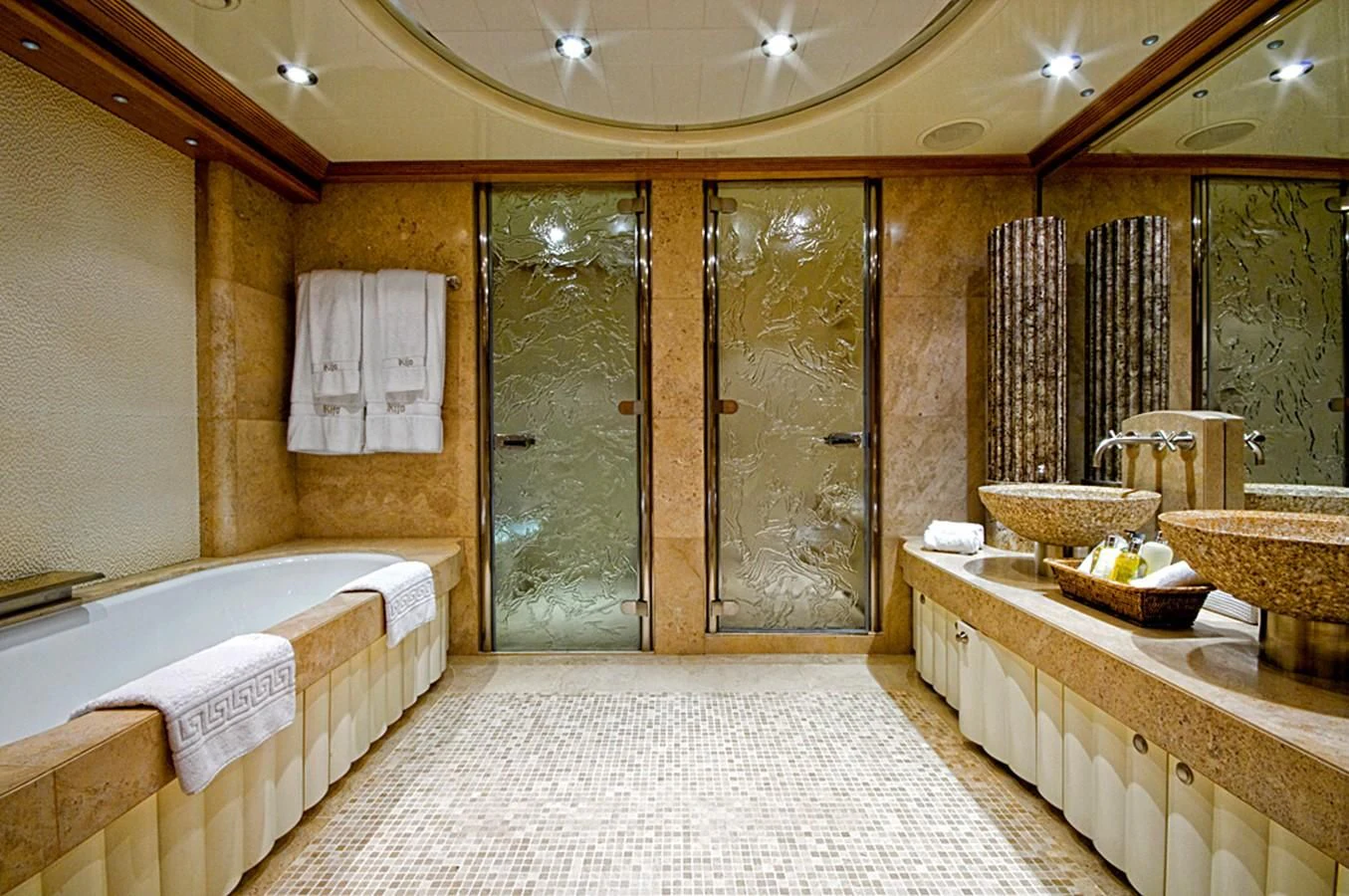 a bathroom with a large glass shower aboard KIJO Yacht for Sale