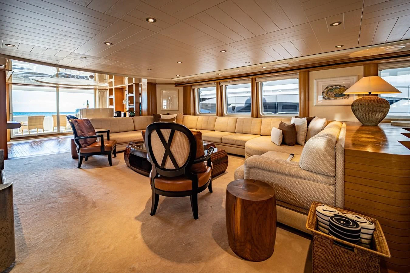 a living room with a couch and a table aboard KIJO Yacht for Sale