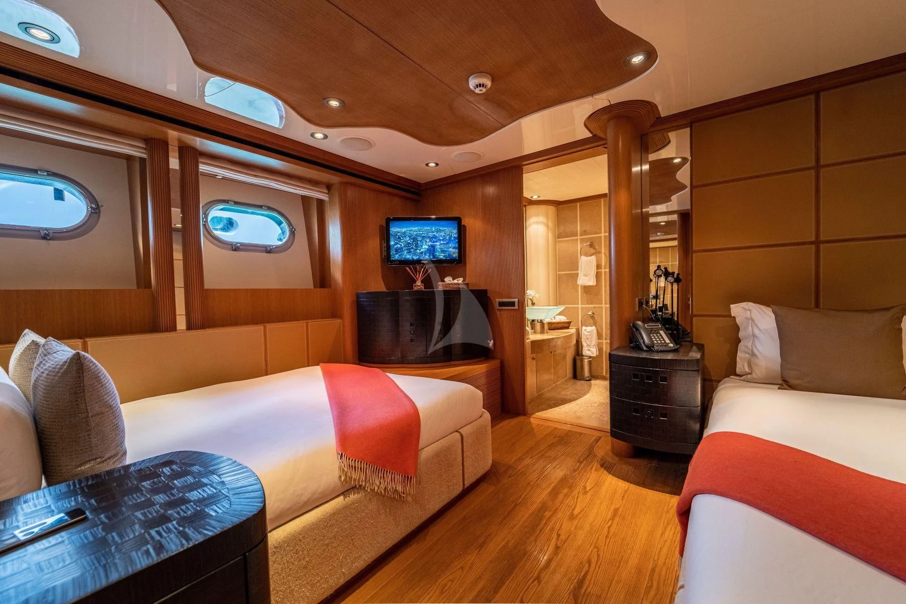 a room with a bed and a television aboard KIJO Yacht for Sale