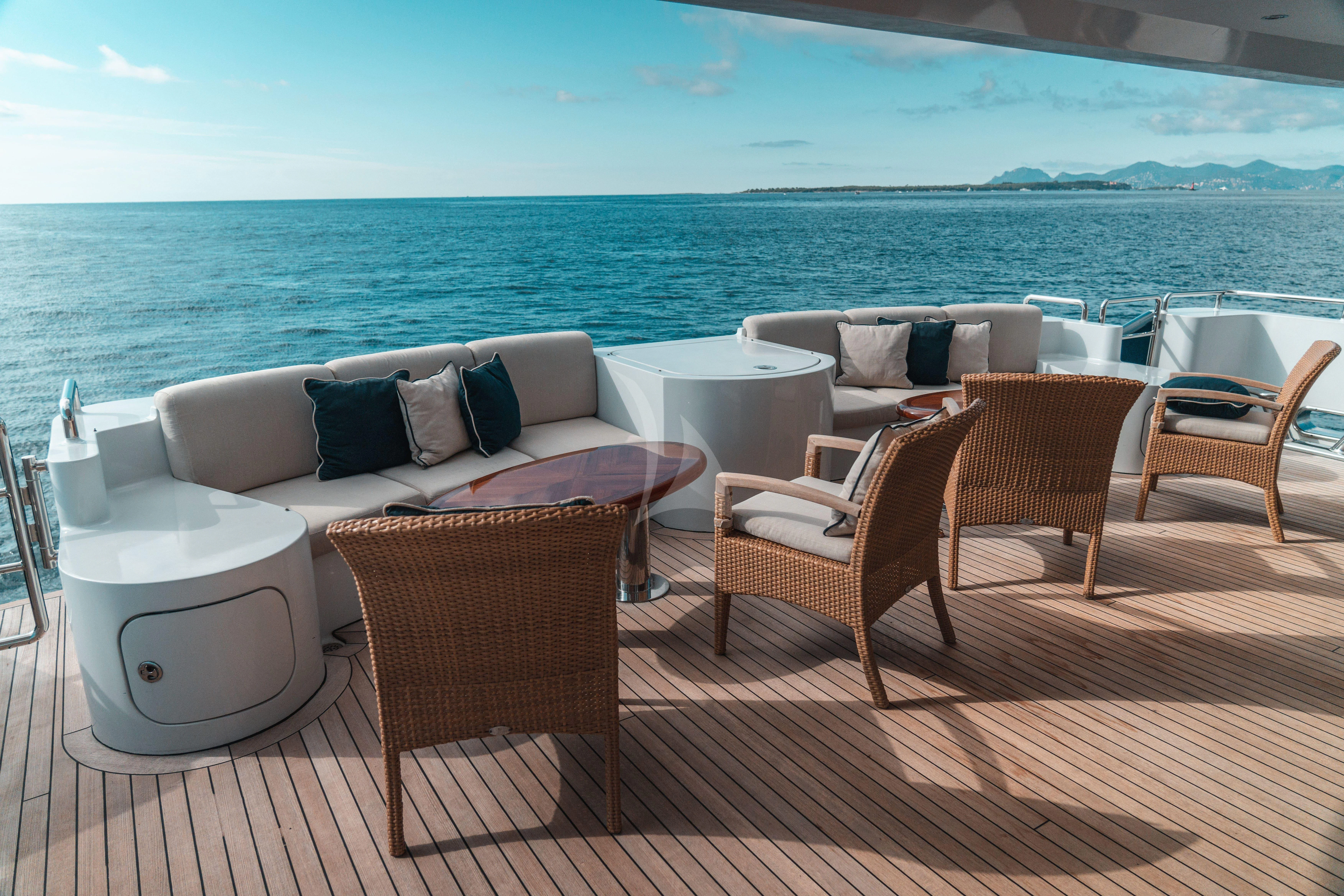 a patio with chairs and a table aboard KIJO Yacht for Sale