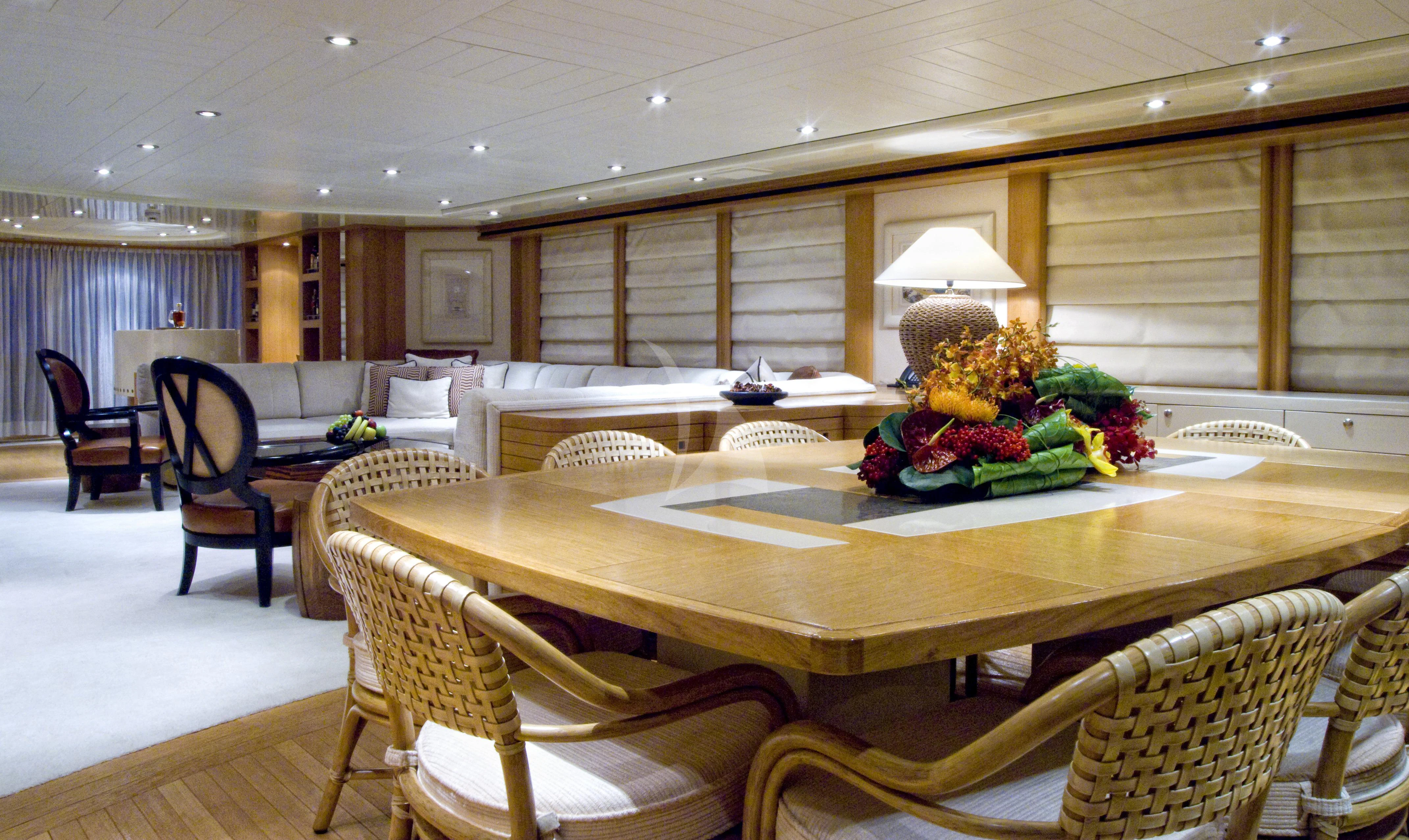 a large room with a table and chairs aboard KIJO Yacht for Sale