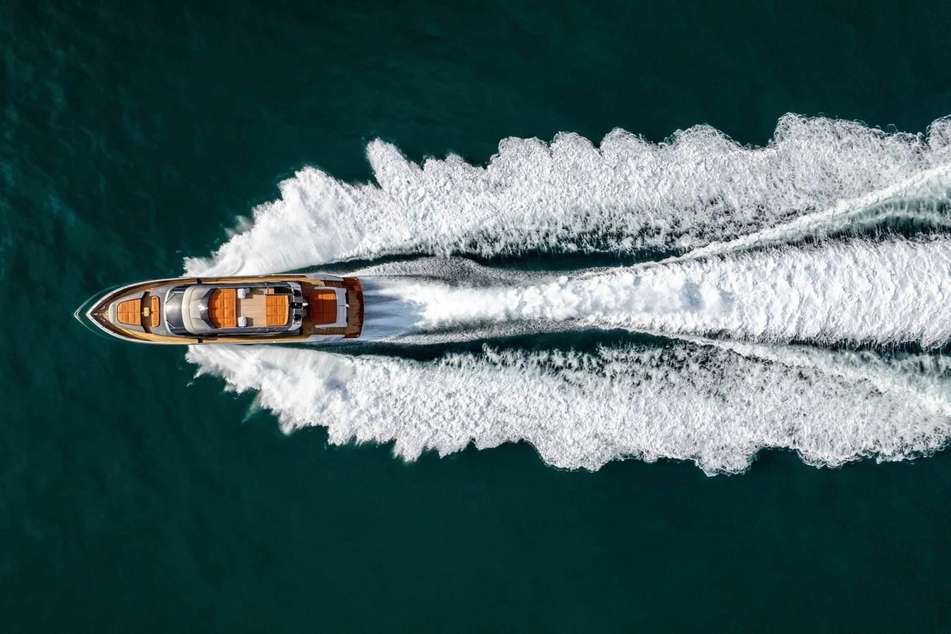a bottle of beer on a beach aboard INCENTIVIZED Yacht for Sale