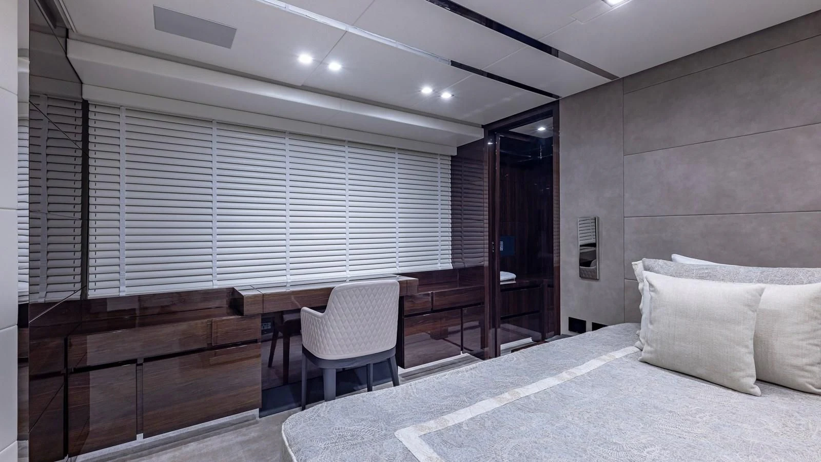 a room with a bed and a desk aboard INCENTIVIZED Yacht for Sale