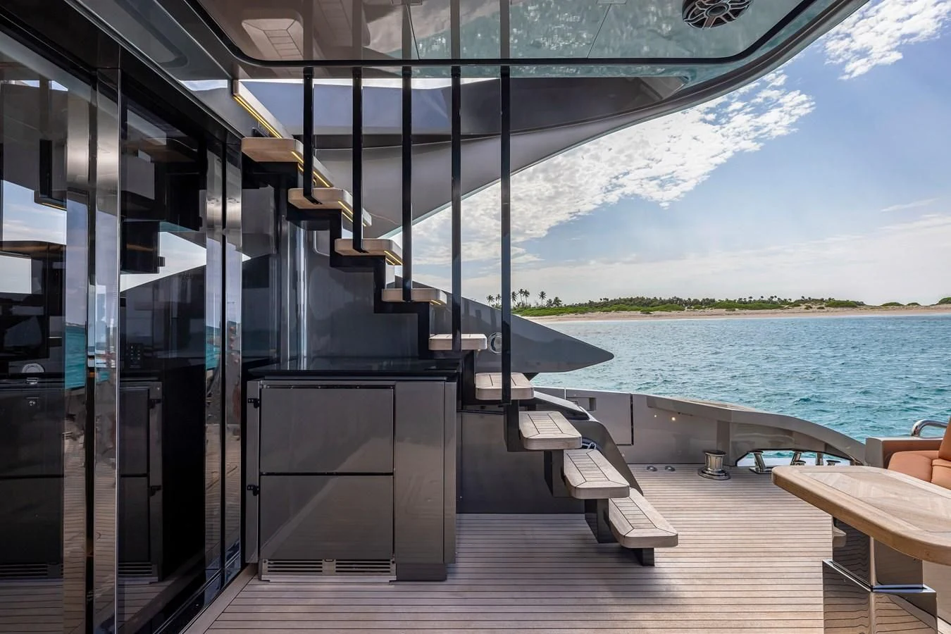 a room with a bench and a table and chairs on it aboard INCENTIVIZED Yacht for Sale