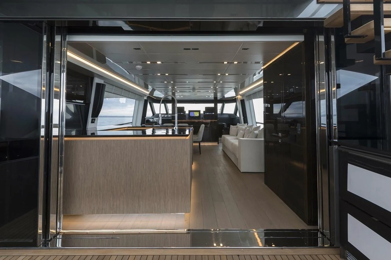 a room with a wood floor and a bench aboard INCENTIVIZED Yacht for Sale