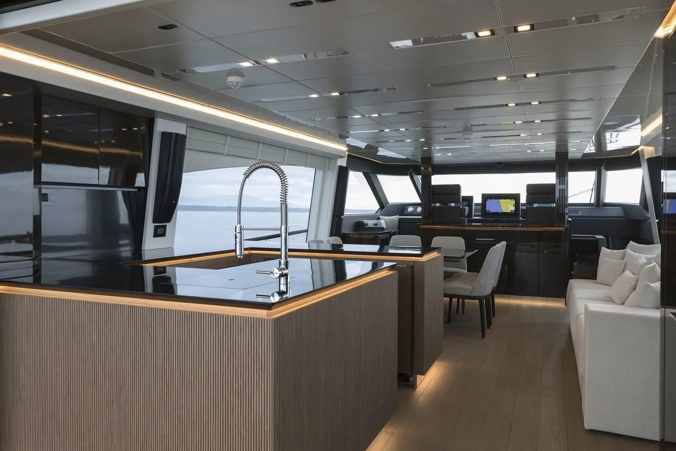 a room with a large table and chairs aboard INCENTIVIZED Yacht for Sale