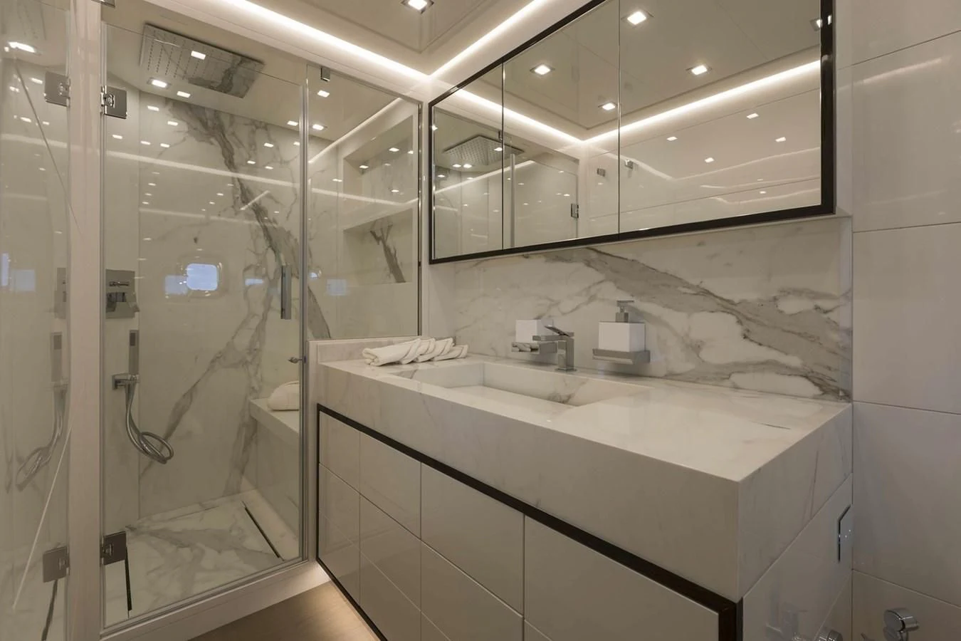 a bathroom with a glass shower aboard INCENTIVIZED Yacht for Sale