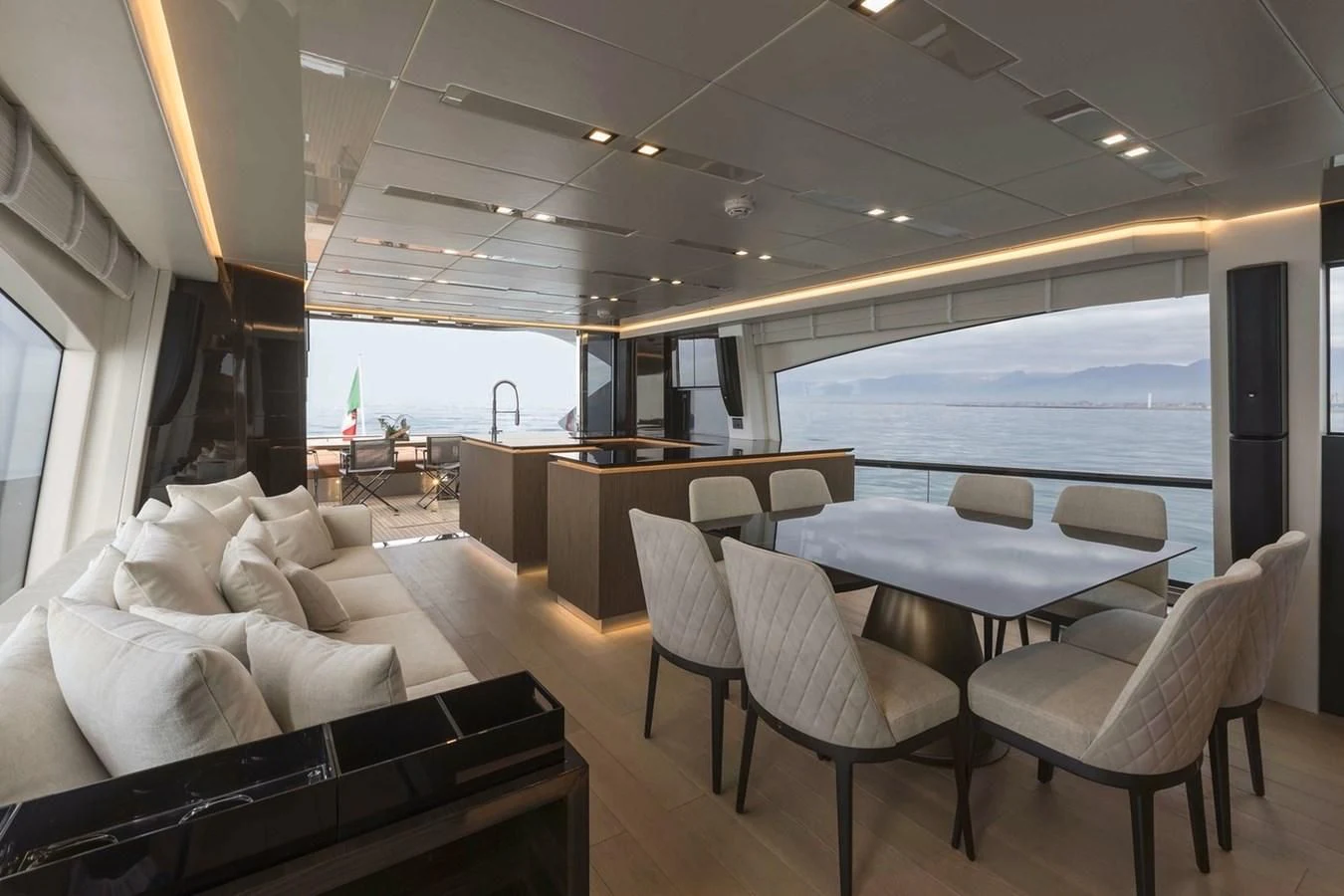 a room with a table and chairs aboard INCENTIVIZED Yacht for Sale