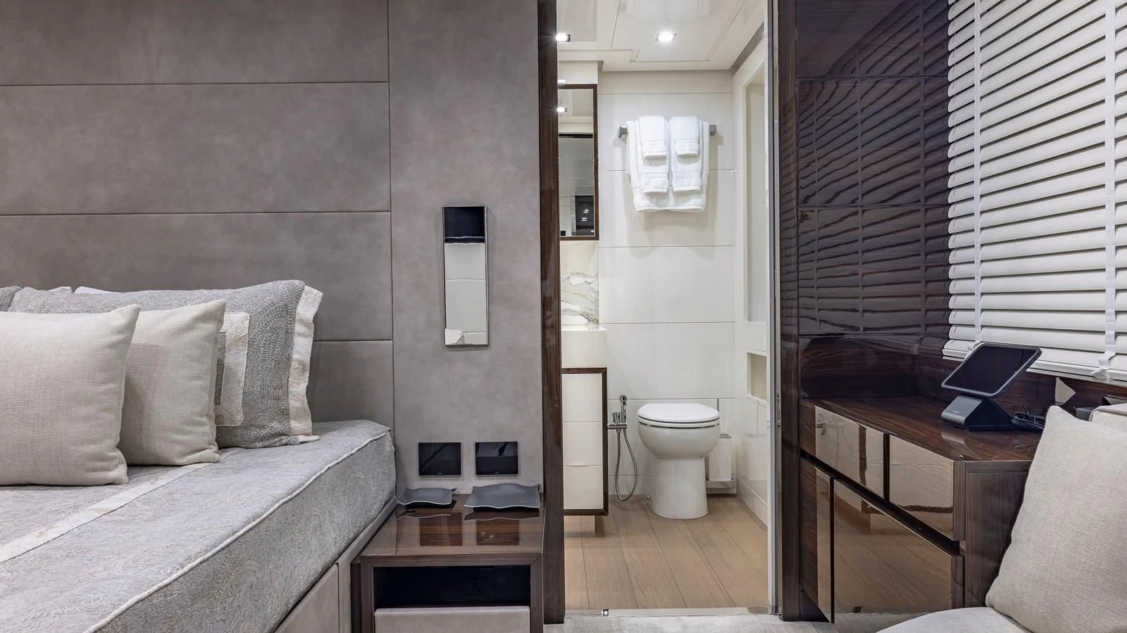 a room with a bed and a desk aboard INCENTIVIZED Yacht for Sale