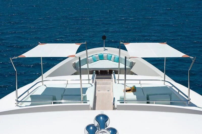 a white boat on the water aboard KIA ORA Yacht for Sale