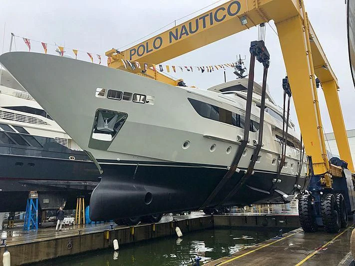 a large boat docked at a pier aboard KIA ORA Yacht for Sale
