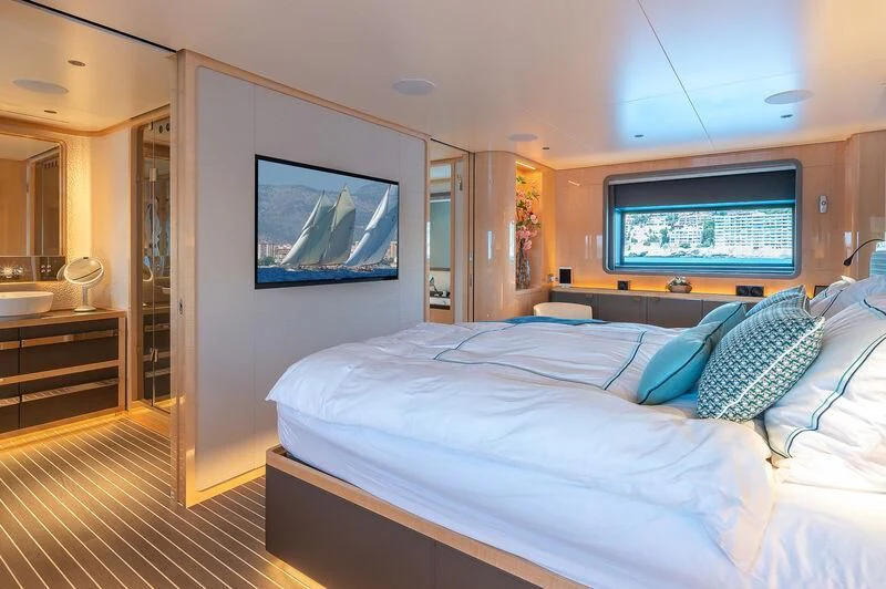 a bedroom with a large bed aboard KIA ORA Yacht for Sale