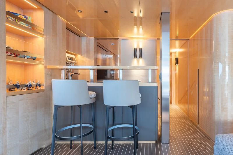 a room with a table and chairs aboard KIA ORA Yacht for Sale