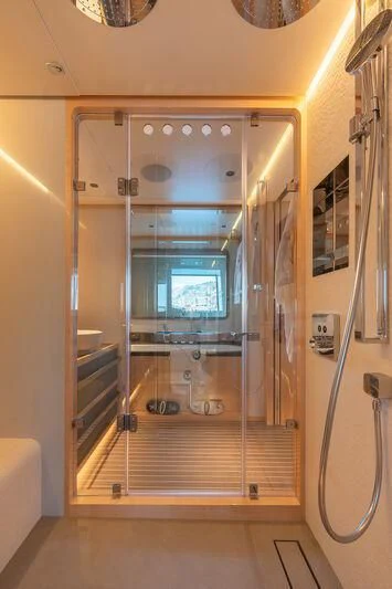 a glass door with a glass window aboard KIA ORA Yacht for Sale