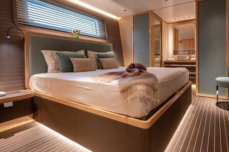 a bed with a dog on it aboard KIA ORA Yacht for Sale