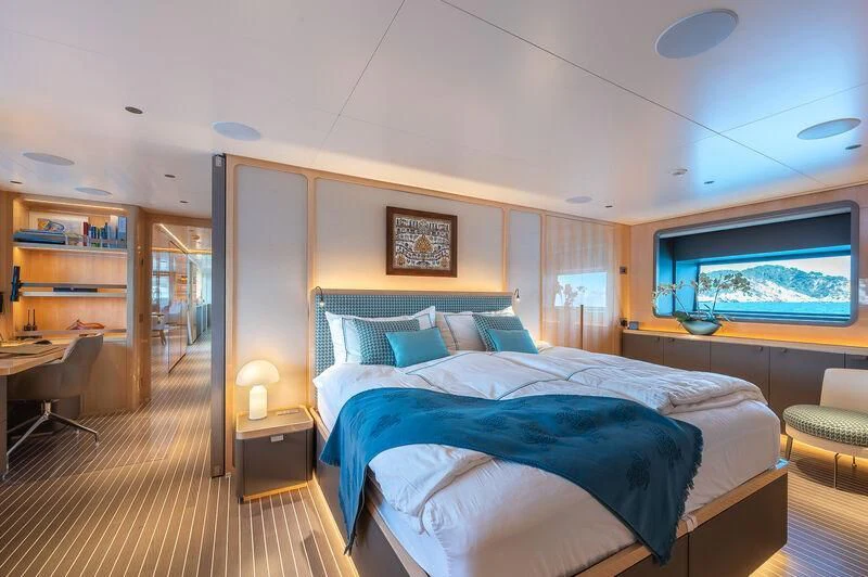 a bedroom with a large bed aboard KIA ORA Yacht for Sale