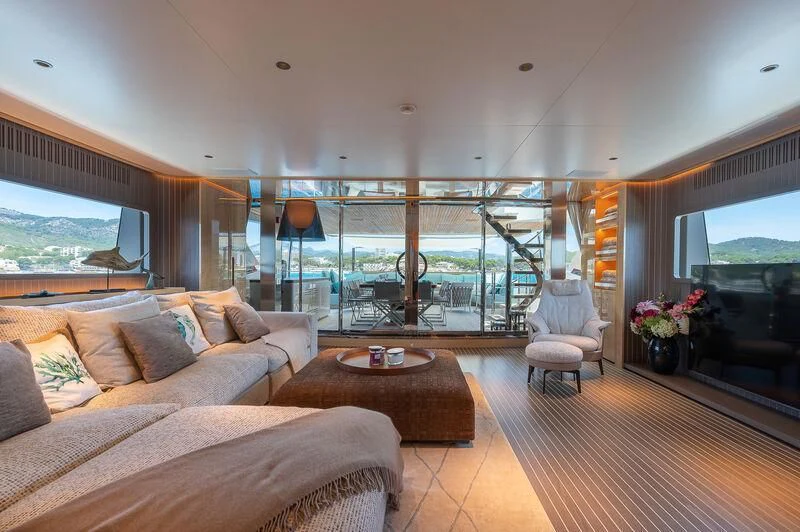 a living room with a large glass window aboard KIA ORA Yacht for Sale