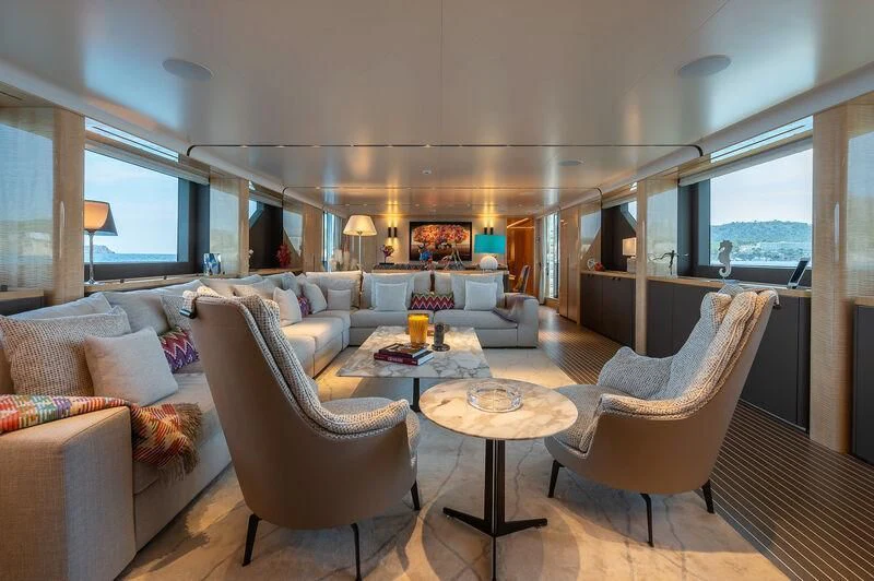 a living room with a couch and a coffee table aboard KIA ORA Yacht for Sale