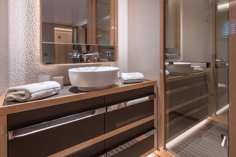 a bathroom with a sink and a mirror aboard KIA ORA Yacht for Sale