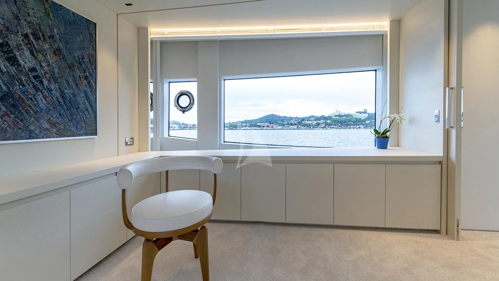 a room with a window and a chair aboard ARSANA Yacht for Charter