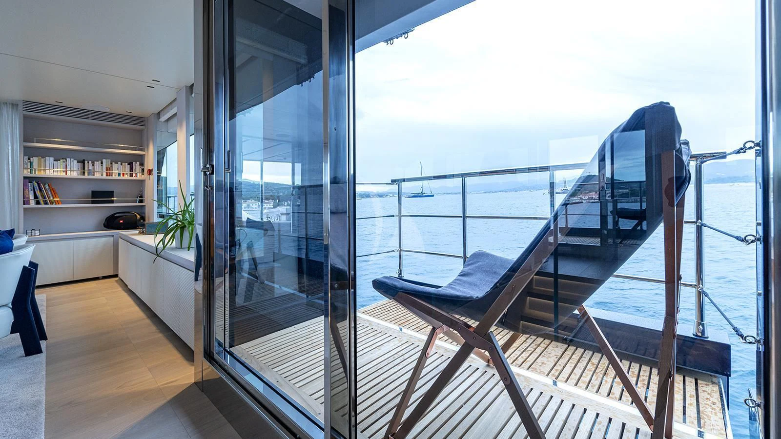 a large glass door leading to a balcony aboard ARSANA Yacht for Charter