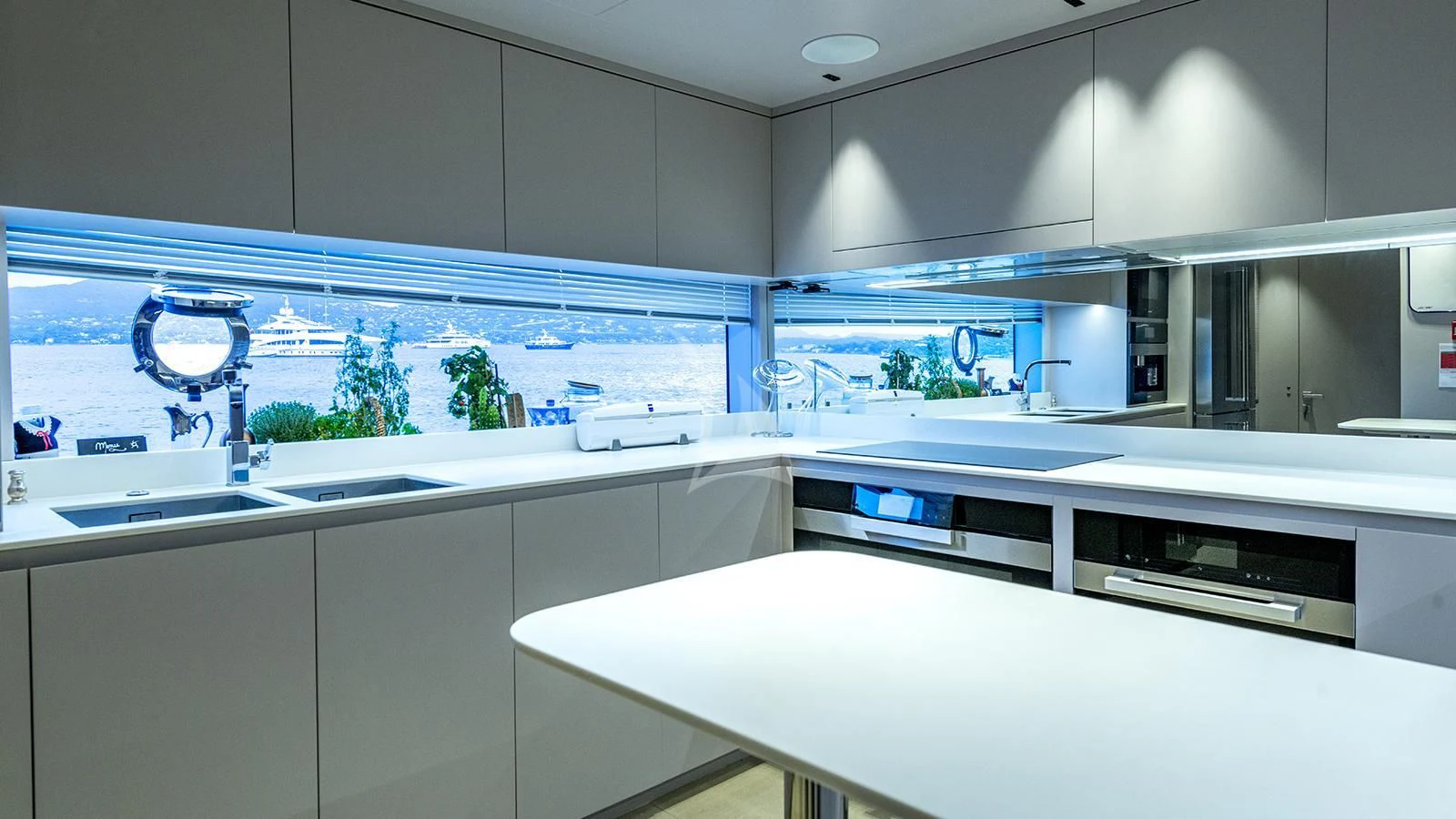 a kitchen with white cabinets aboard ARSANA Yacht for Charter