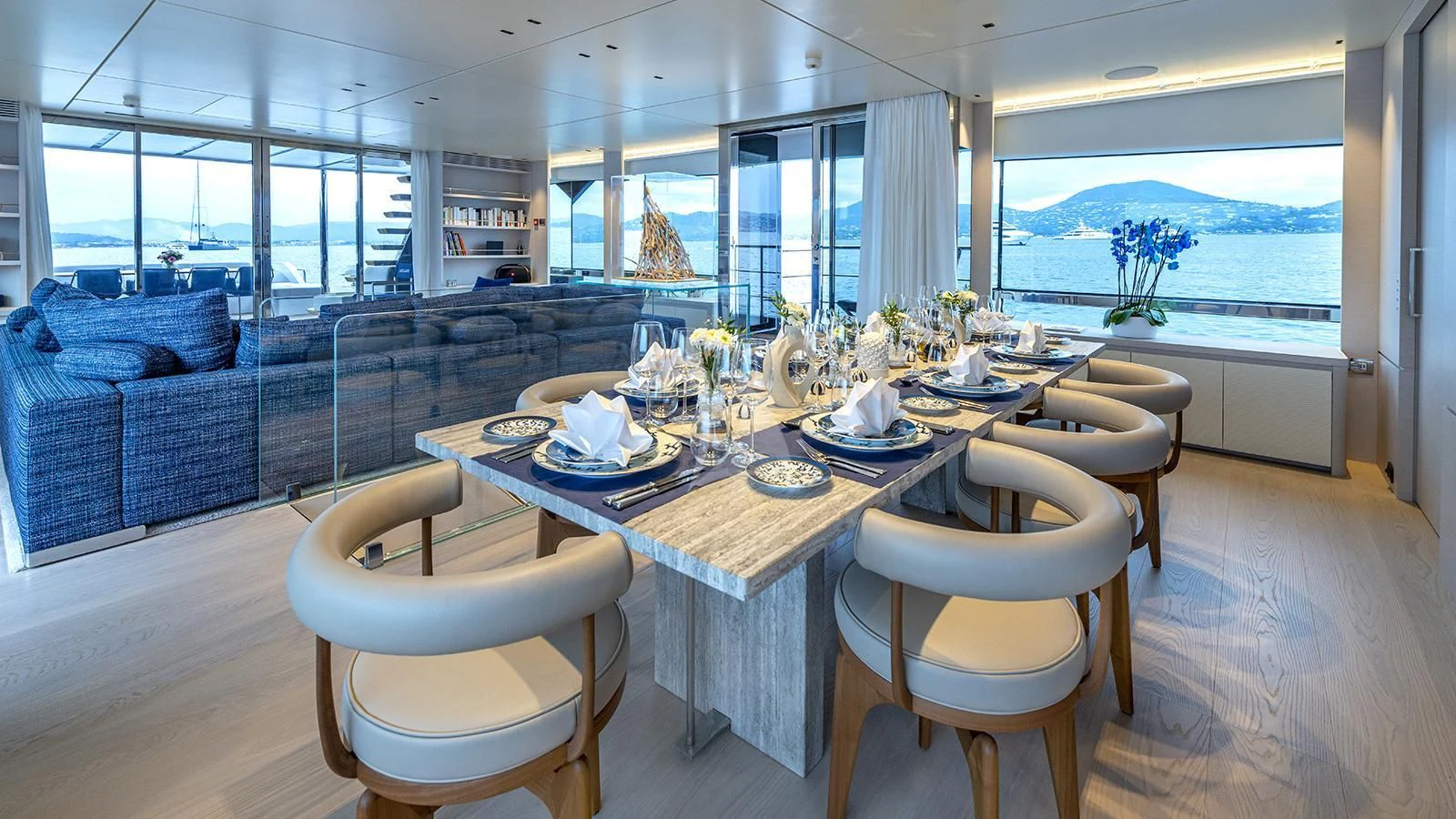 a dining table in a living room aboard ARSANA Yacht for Charter