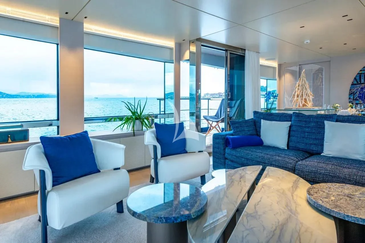 a living room with a large window aboard ARSANA Yacht for Charter