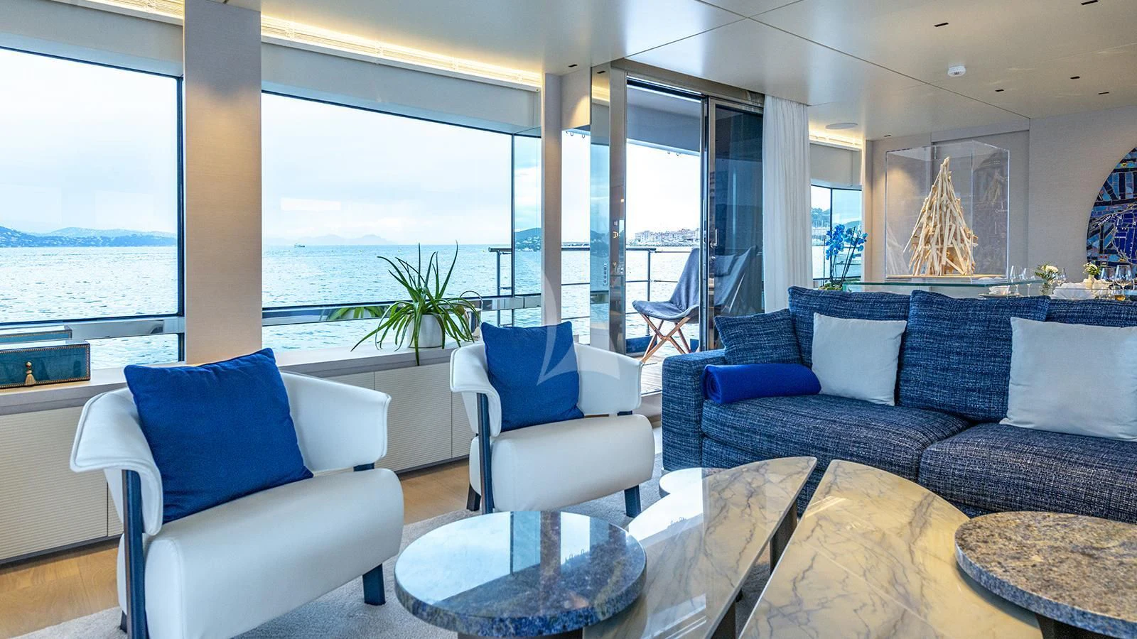 a living room with a large window aboard ARSANA Yacht for Charter