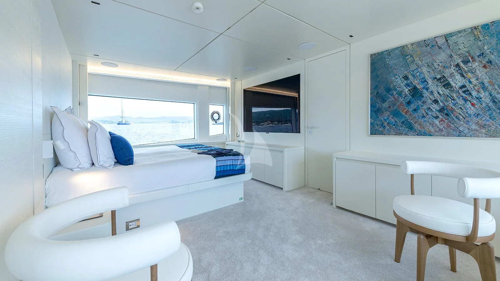 a room with white furniture aboard ARSANA Yacht for Charter