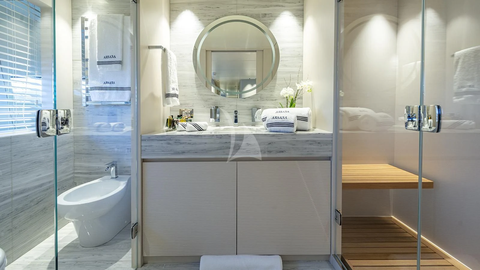a bathroom with a sink toilet and a mirror aboard ARSANA Yacht for Charter