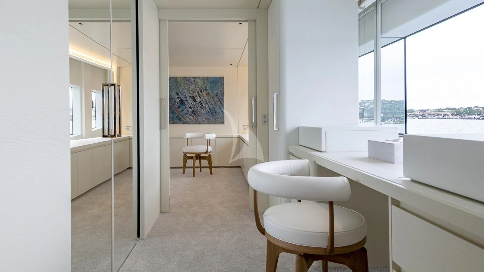 a room with a table and stools aboard ARSANA Yacht for Charter