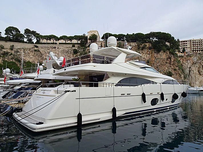 a white boat in a harbor aboard CASTA DIVA Yacht for Sale