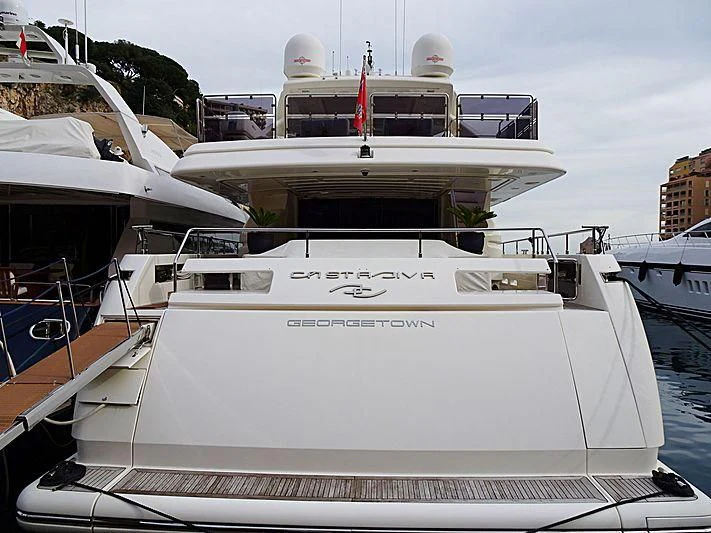 a white yacht in a harbor aboard CASTA DIVA Yacht for Sale