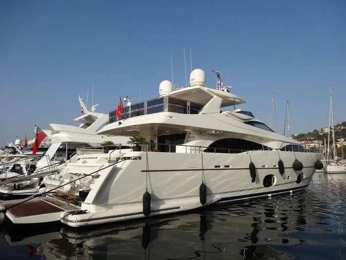 a large white boat in a harbor aboard CASTA DIVA Yacht for Sale
