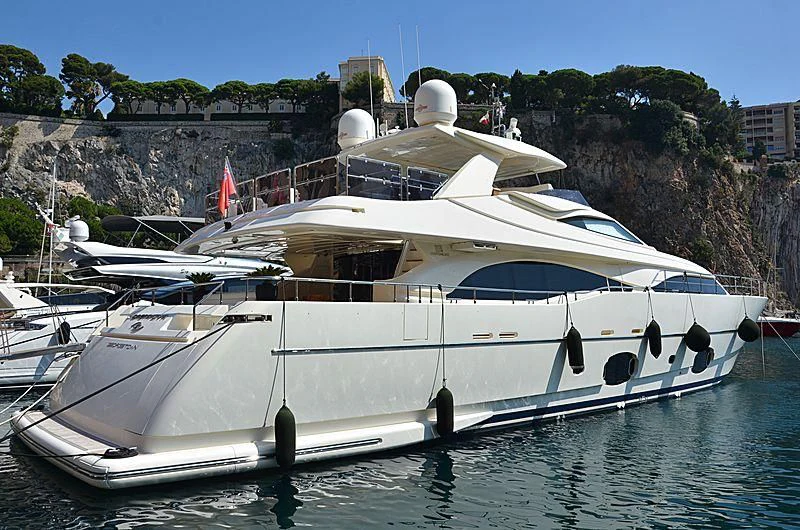 a white yacht in a harbor aboard CASTA DIVA Yacht for Sale