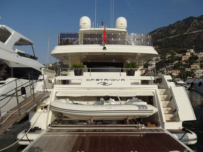 a large white boat in a harbor aboard CASTA DIVA Yacht for Sale