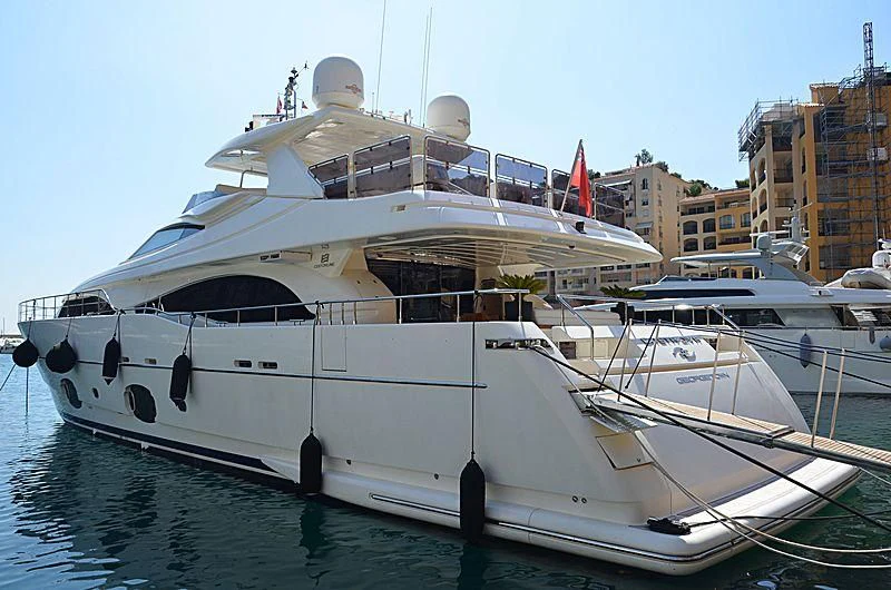 a large white boat in a harbor aboard CASTA DIVA Yacht for Sale