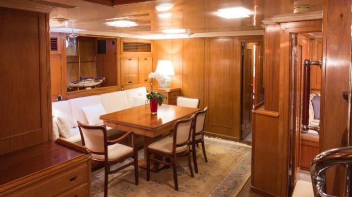 a dining table in a room aboard FEI-SEEN Yacht for Sale