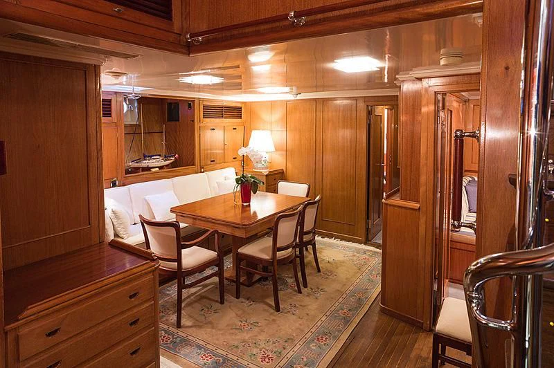 a dining room with a table and chairs aboard FEI-SEEN Yacht for Sale